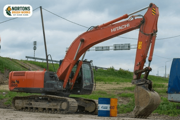 Laser guided grading equipment leveling soil for precision construction pad